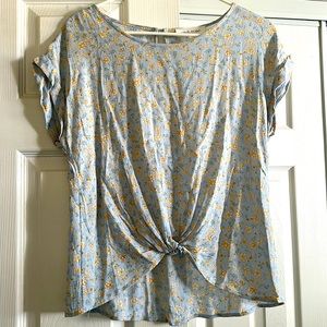 Floral blouse with keyhole button and knotted waistline